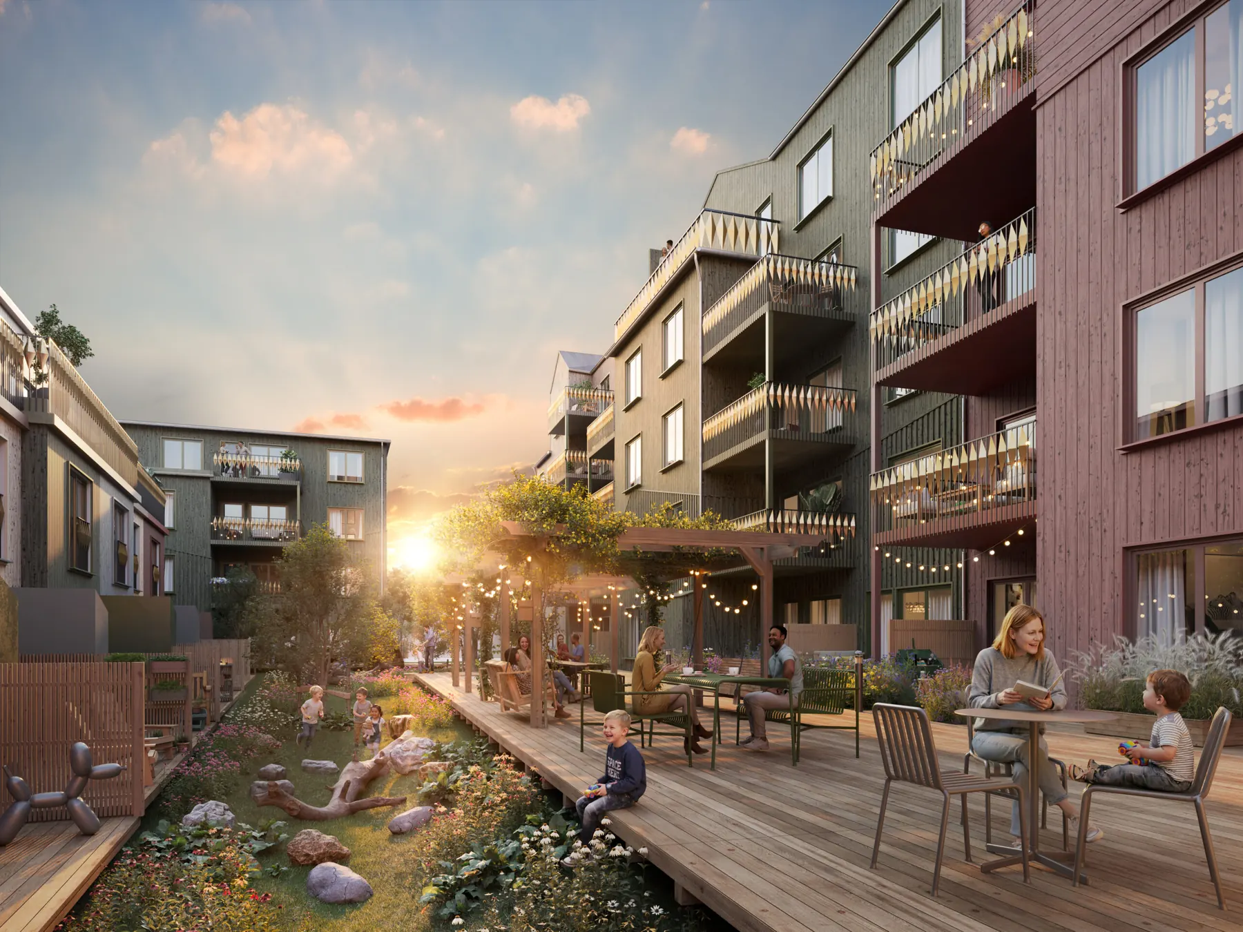 Courtyard in the neighbourhood with boardwalks, greenery and evening sun.